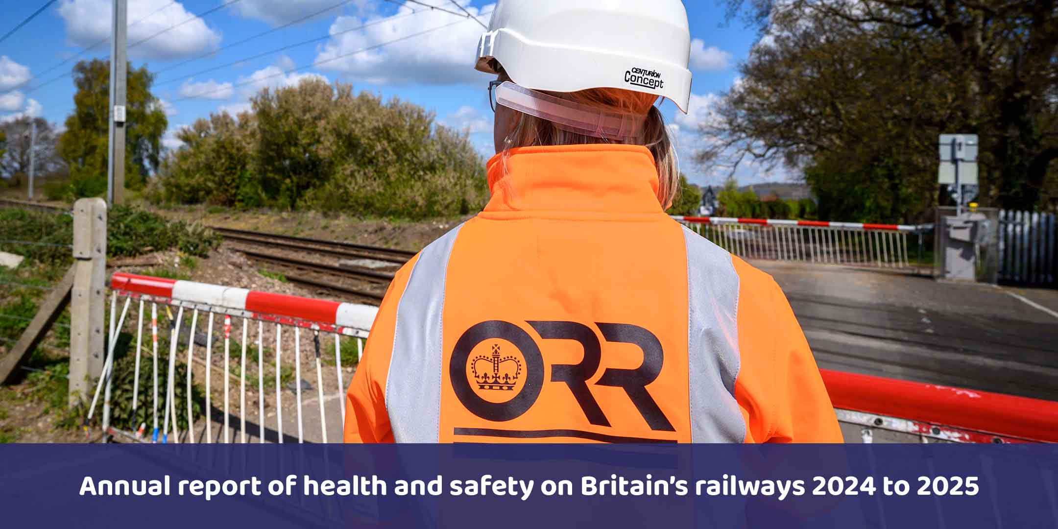 ORR Inspector in PPE on a site visit at a level crossing.