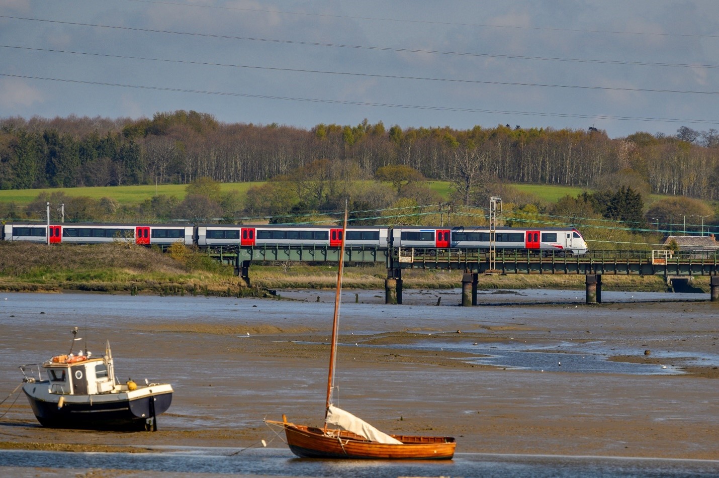 Greater Anglia train over a bridge in an estuary.