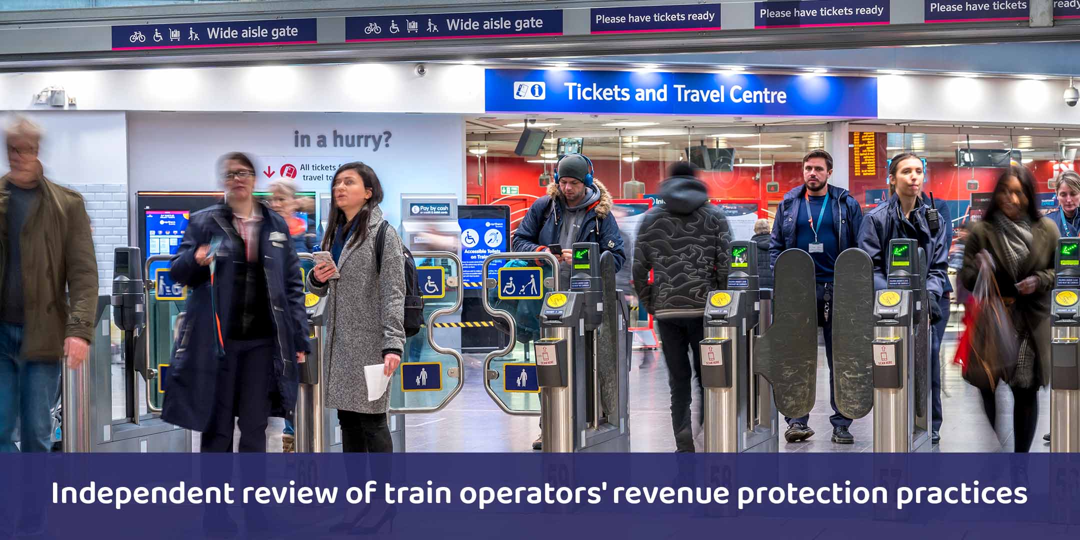 Passengers through ticket gates at Manchester Piccadilly station