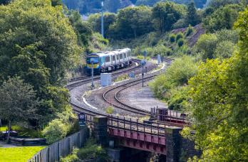 Passenger train travelling through countryside