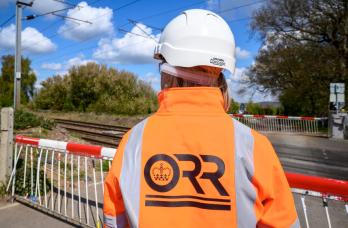ORR inspector in PPE at a level crossing site visit.