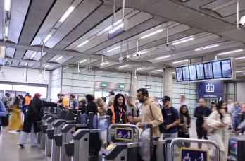 Passengers through ticket gates at St Pancras International station