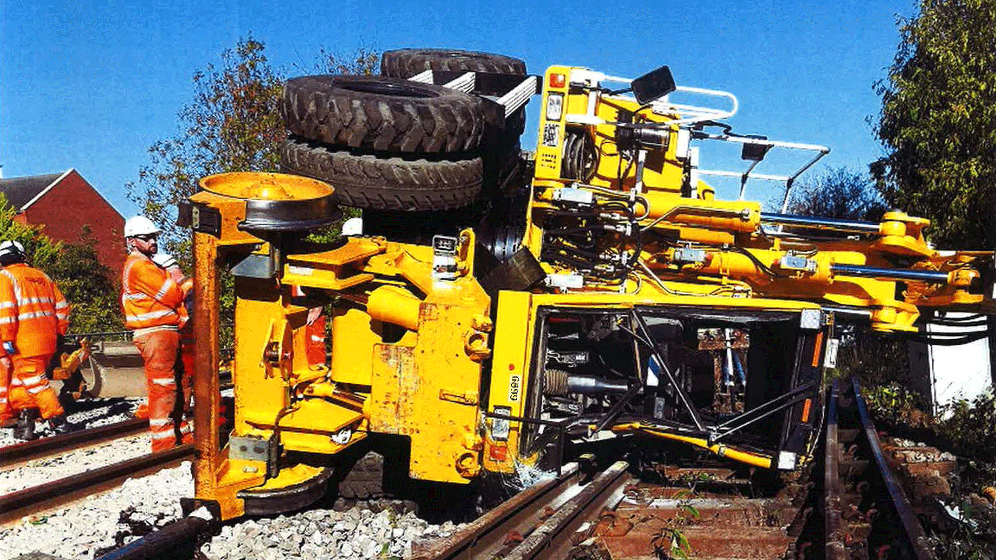 overturned road-rail excavator vehicle 