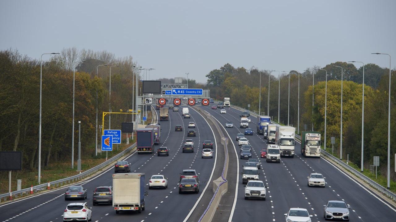 Photo of a motorway, with variable speed signs