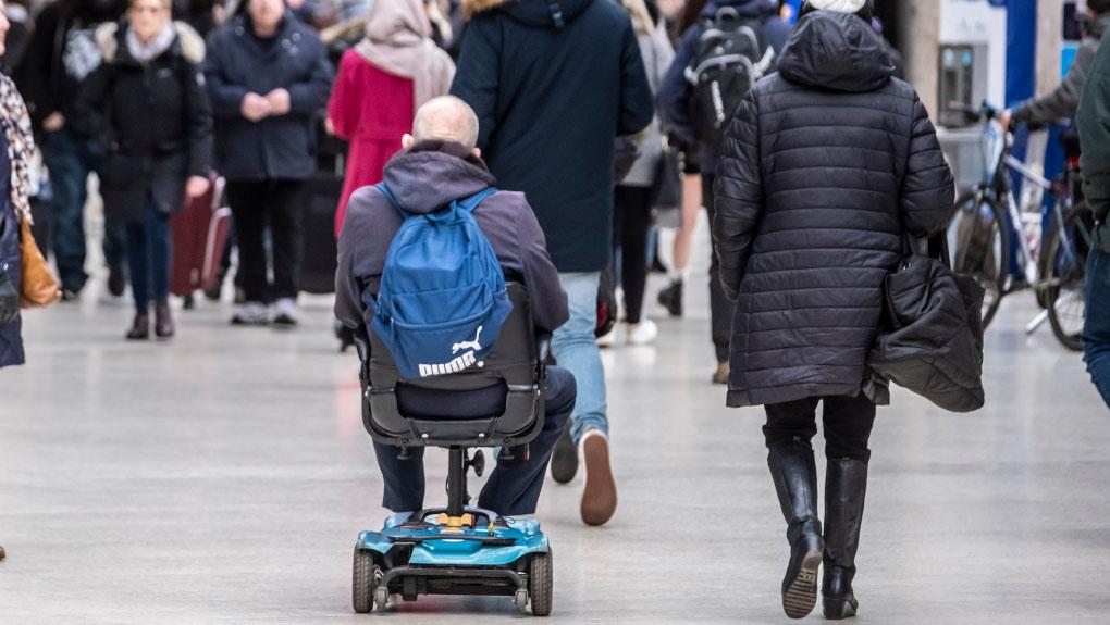 Mobility scooter user at Glasgow Central railway station