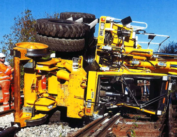 overturned road-rail excavator vehicle 