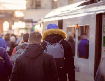 Passengers at a railway station in Britain