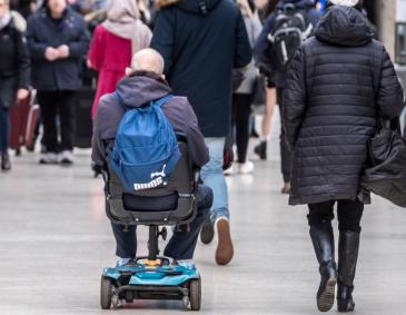 Mobility scooter user at Glasgow Central railway station